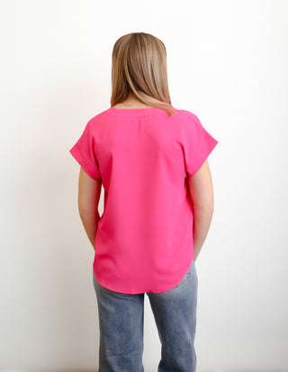 The wear me to work top can be dressed up or down and comes in some great Spring colors. 
No stretch and NOT a loose fit. Size up for loose fit. 
comes in denim blue, fuchsia and sienna
