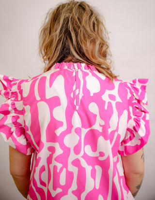 <p>Indulge in the perfect blend of spunk and sophistication with our Hot Pink & White Print top. The ruffle sleeves add a touch of femininity to the bold hot pink color, making it a statement piece for any occasion. Elevate your style with this exclusive and tasteful piece. Fits true to size.