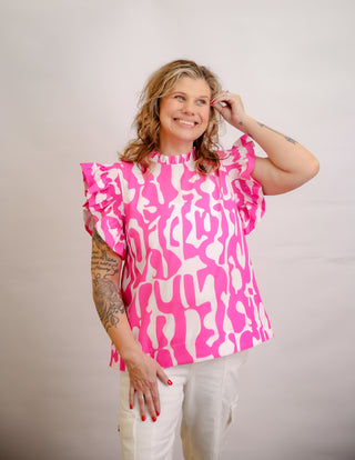 <p>Indulge in the perfect blend of spunk and sophistication with our Hot Pink & White Print top. The ruffle sleeves add a touch of femininity to the bold hot pink color, making it a statement piece for any occasion. Elevate your style with this exclusive and tasteful piece. Fits true to size.