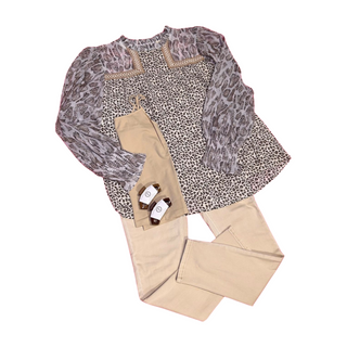 Animal print blouse with button closure at the back of the neck. Puffy sleeves with stretch at the wrist. Embroidery detail at the neck/chest area.