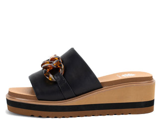 Minimal slide sandal with chunky hardware with square toe and high rebound padding.