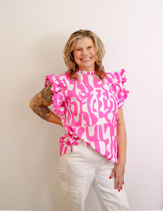 <p>Indulge in the perfect blend of spunk and sophistication with our Hot Pink & White Print top. The ruffle sleeves add a touch of femininity to the bold hot pink color, making it a statement piece for any occasion. Elevate your style with this exclusive and tasteful piece.Fits true to size.