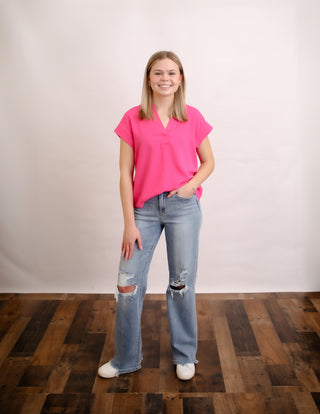 The wear me to work top can be dressed up or down and comes in some great Spring colors. 
No stretch and NOT a loose fit. Size up for loose fit. 
comes in denim blue, fuchsia and sienna