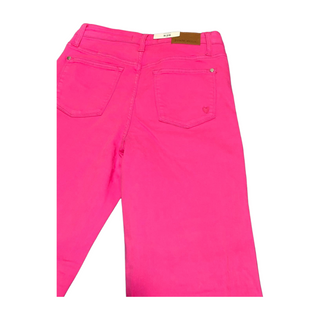 Hot pink Judy Blue garment dyed 90’s straight jeans with heart pocket detail on right back pocket and raw hem. 