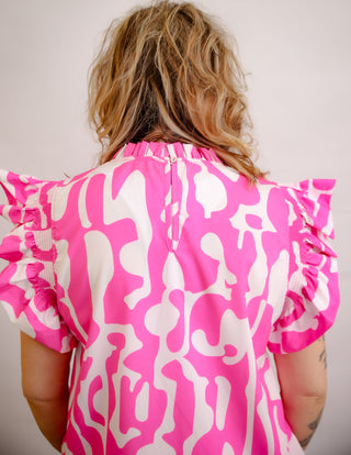 <p>Indulge in the perfect blend of spunk and sophistication with our Hot Pink &amp; White Print top. The ruffle sleeves add a touch of femininity to the bold hot pink color, making it a statement piece for any occasion. Elevate your style with this exclusive and tasteful piece. Fits true to size.