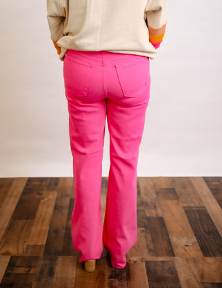 Hot pink Judy Blue straight jeans with heart pocket detail.