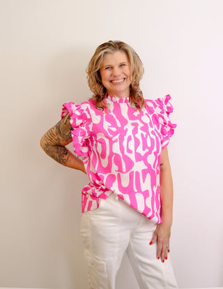 <p>Indulge in the perfect blend of spunk and sophistication with our Hot Pink &amp; White Print top. The ruffle sleeves add a touch of femininity to the bold hot pink color, making it a statement piece for any occasion. Elevate your style with this exclusive and tasteful piece.Fits true to size. 